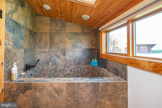 bathroom with lofted ceiling with skylight and wood ceiling