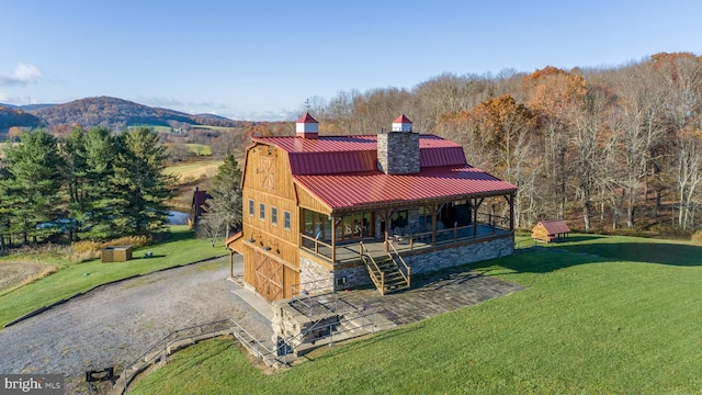 exterior space with a yard and a mountain view