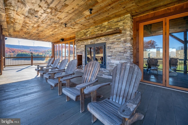 wooden deck with a mountain view