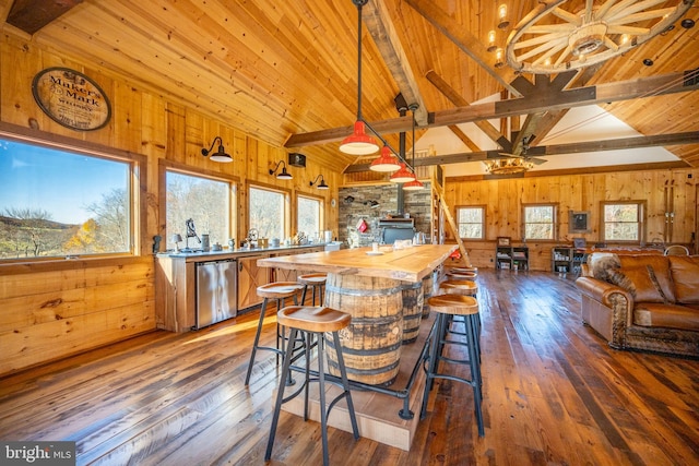 kitchen featuring a wood stove, dark wood-type flooring, and wood counters