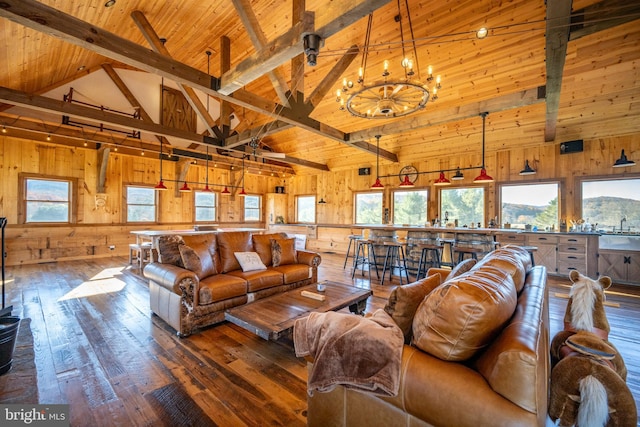 living room with wood ceiling, hardwood / wood-style floors, wood walls, high vaulted ceiling, and beamed ceiling