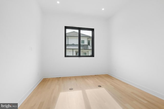 empty room featuring wood-type flooring