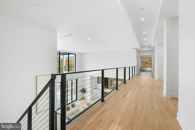 hall with light hardwood / wood-style floors