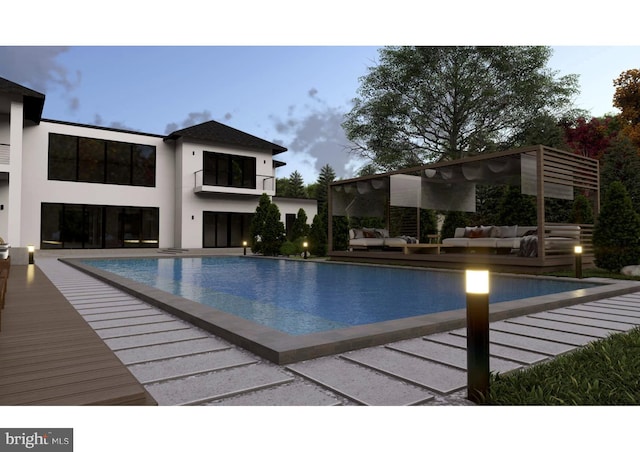 pool at dusk featuring an outdoor hangout area