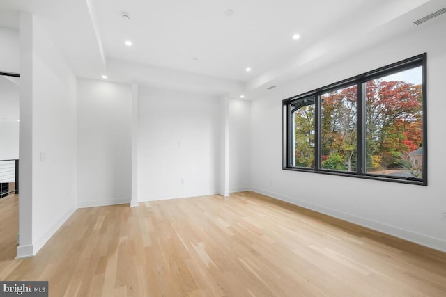 unfurnished room featuring light hardwood / wood-style floors