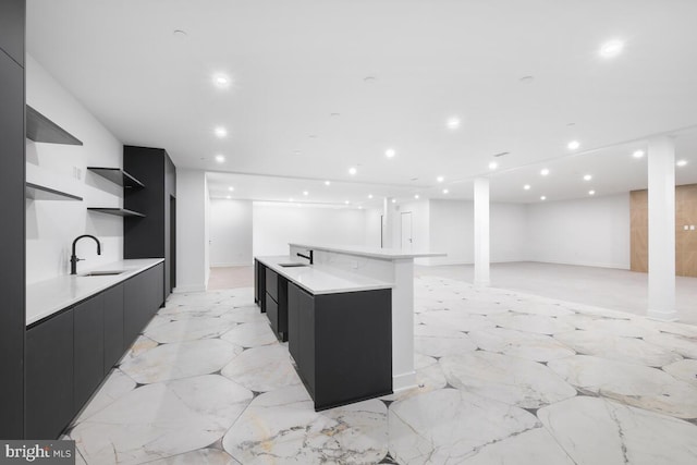 kitchen featuring sink and a spacious island