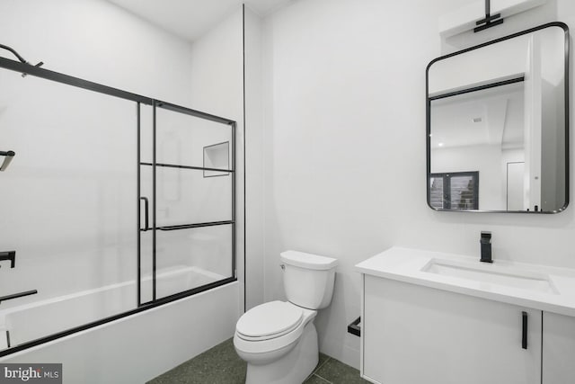 full bathroom with enclosed tub / shower combo, tile patterned floors, toilet, and vanity