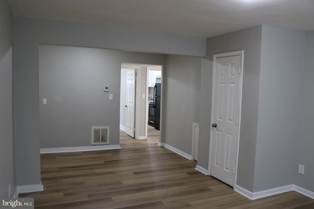 hall featuring dark wood-type flooring