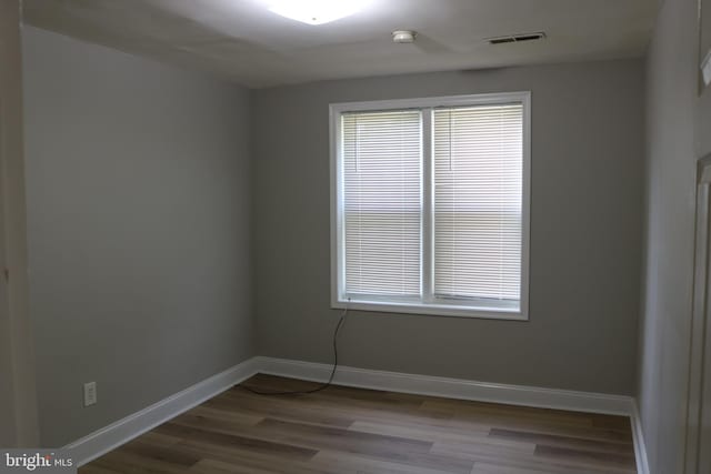 unfurnished room with light wood-type flooring