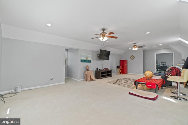 living area with light carpet and ceiling fan