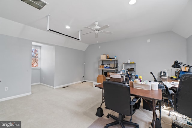 office space featuring ceiling fan, lofted ceiling, and light colored carpet