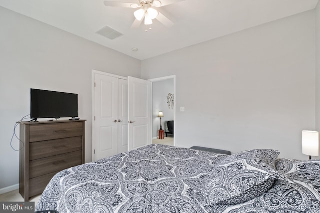 bedroom with ceiling fan, a closet, and carpet floors