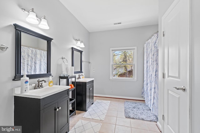 bathroom with vanity and tile patterned flooring