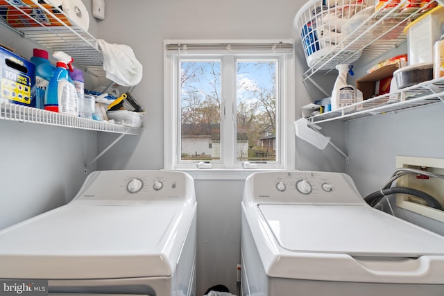 clothes washing area with washer and dryer