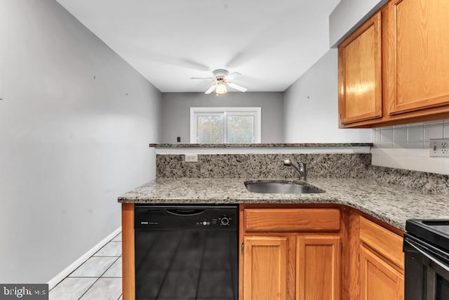 kitchen with black appliances, light tile patterned floors, sink, ceiling fan, and light stone countertops