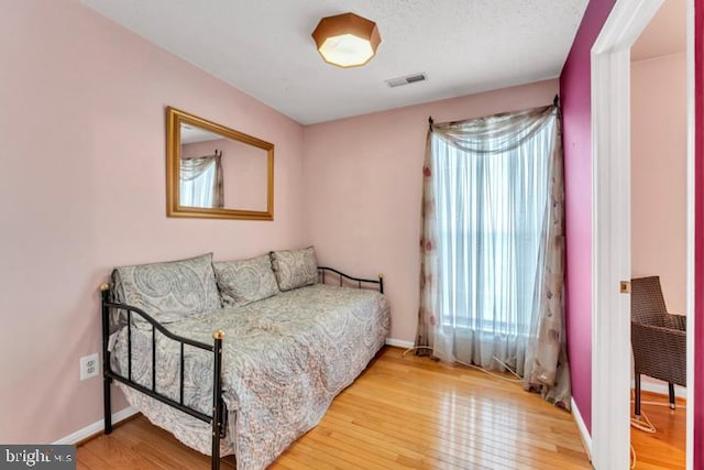 bedroom featuring hardwood / wood-style flooring