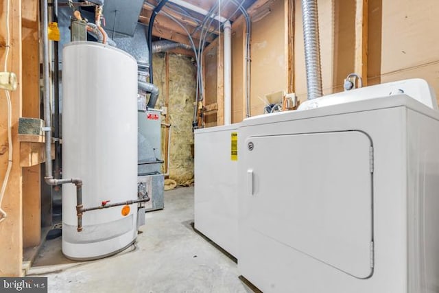 utilities with gas water heater and washer / dryer