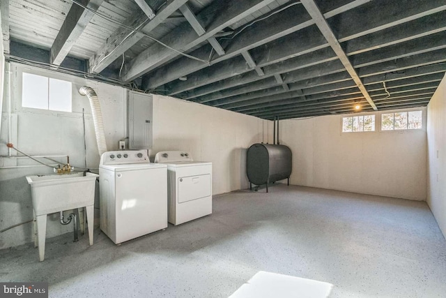 basement featuring sink and independent washer and dryer