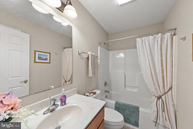 full bathroom with vanity, shower / bath combo, and toilet