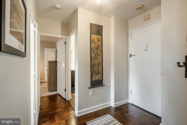 hall with dark parquet floors