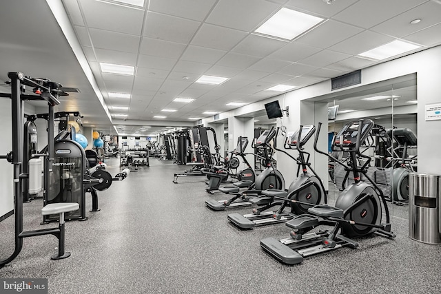 workout area featuring a paneled ceiling