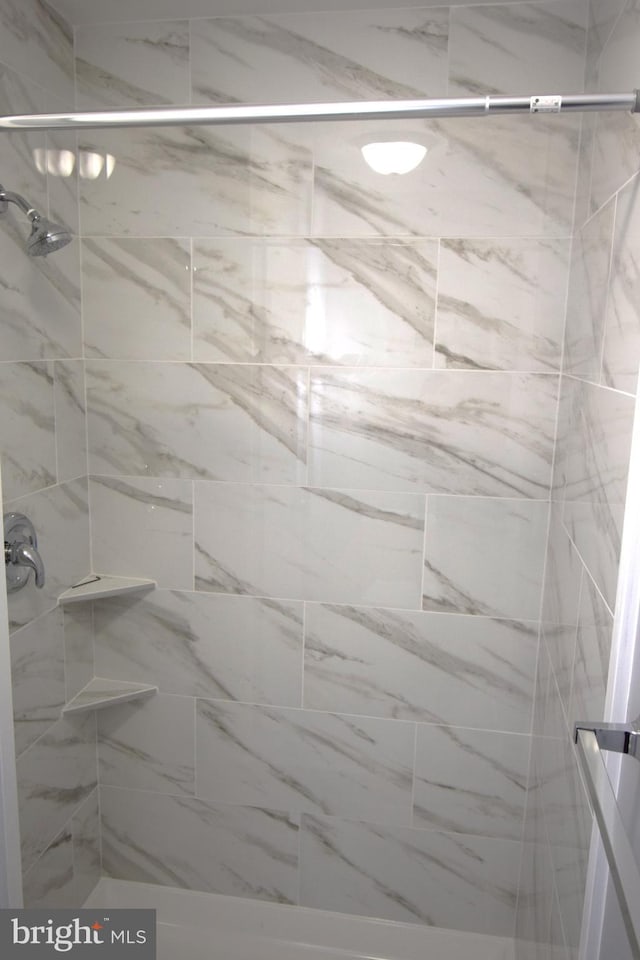 full bathroom with a shower stall