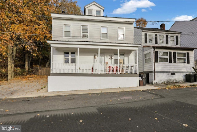 view of front of property featuring covered porch