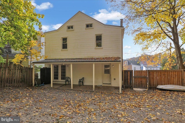 back of property featuring a patio