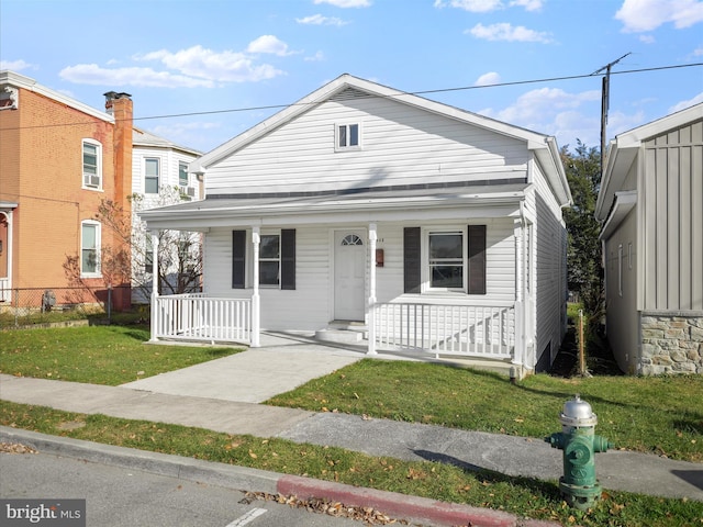 view of front of home with a front lawn and a porch