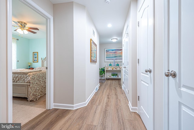 corridor featuring light wood-type flooring