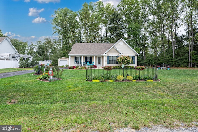 view of front of home featuring a garage and a front lawn