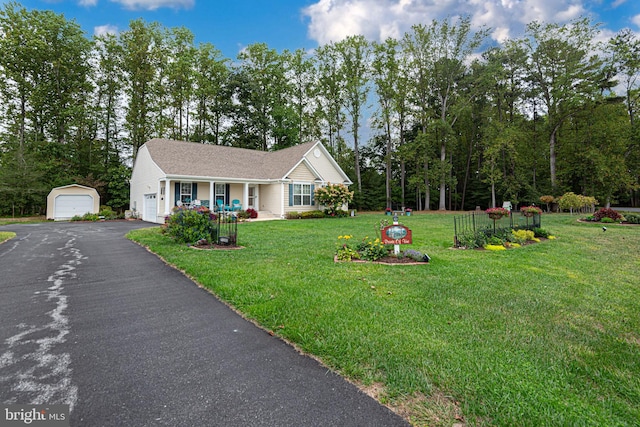 view of front of property with a front lawn and a garage