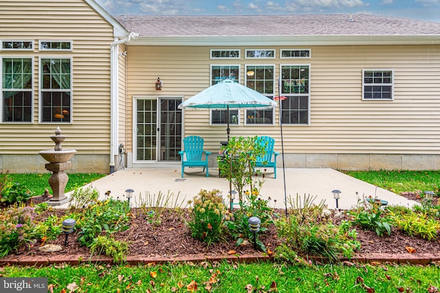 rear view of house with a patio