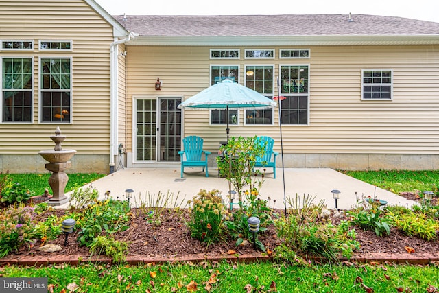 back of property with a patio area