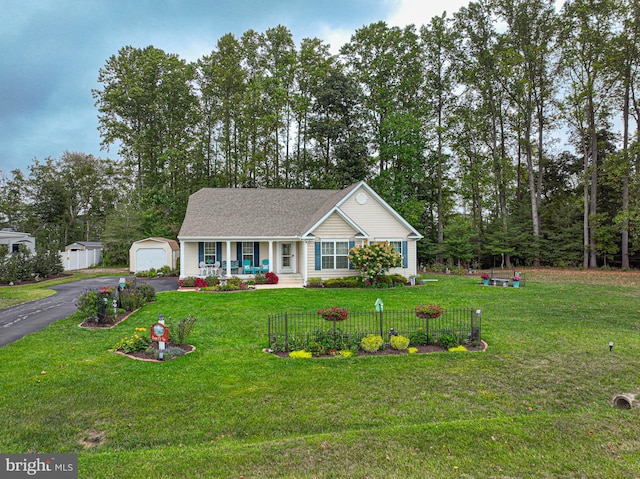 ranch-style house with a front yard and covered porch