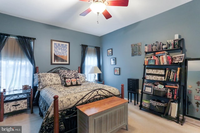 bedroom featuring ceiling fan and light colored carpet