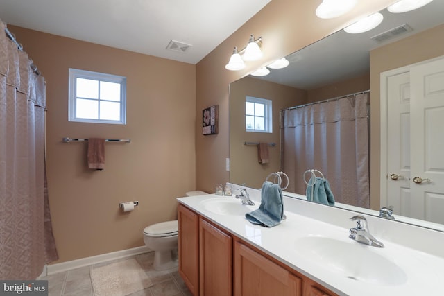 bathroom featuring toilet and vanity