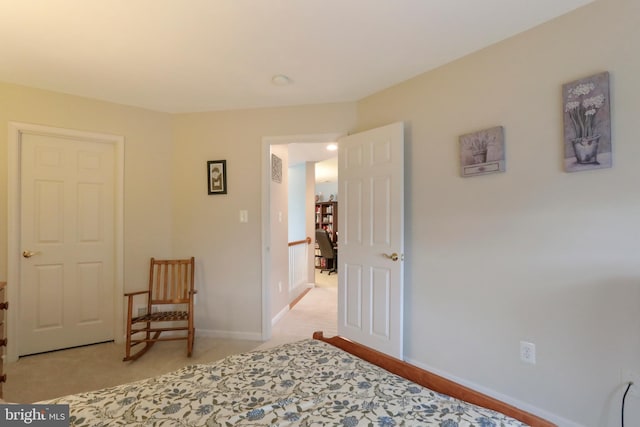 bedroom featuring light colored carpet