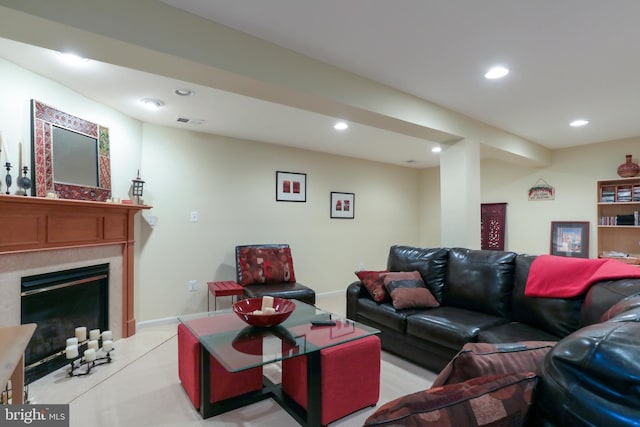 living room featuring a high end fireplace