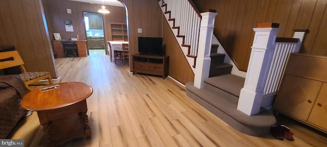 interior space featuring wooden walls and wood-type flooring