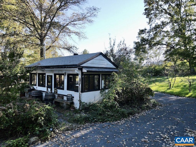 view of front of property featuring a sunroom