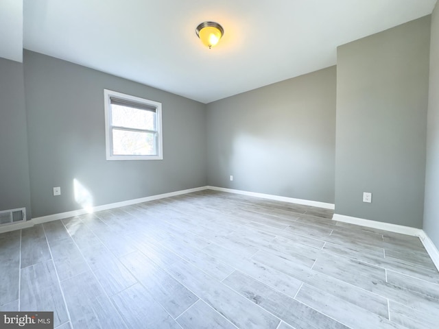 unfurnished room featuring light wood-type flooring