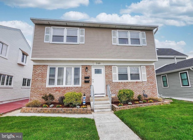 view of front facade featuring a front yard