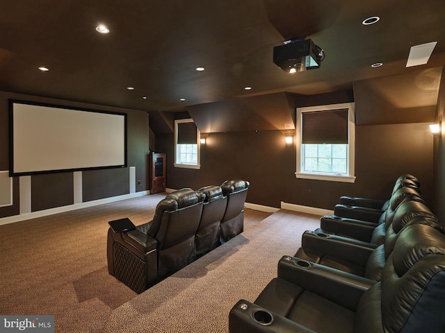 home theater room featuring carpet flooring and a wealth of natural light