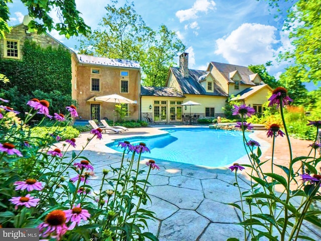 view of swimming pool with a patio