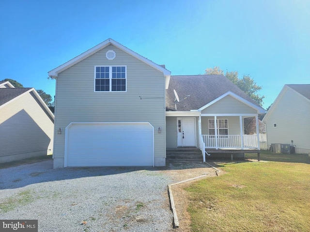 view of front of house with a front lawn and a garage