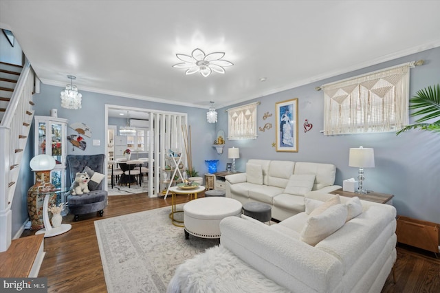 living room featuring dark hardwood / wood-style flooring and ornamental molding