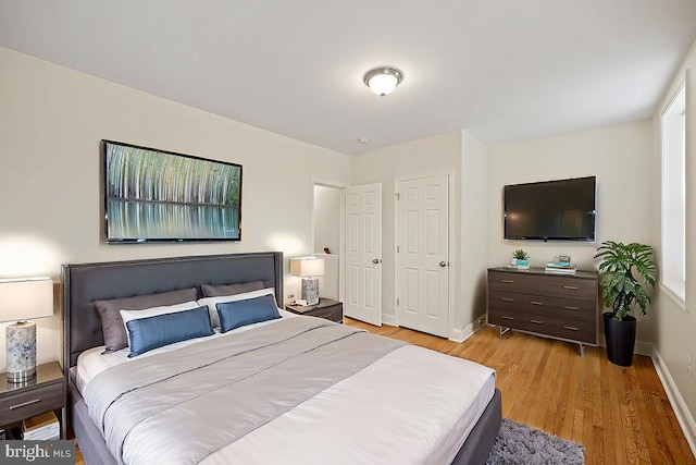 bedroom with light hardwood / wood-style flooring