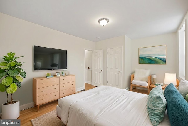 bedroom with wood-type flooring