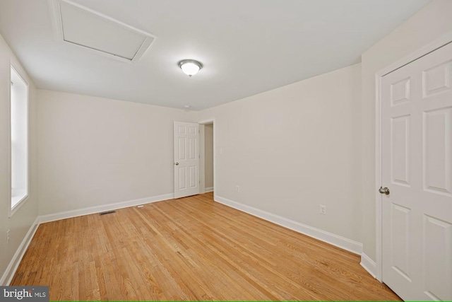 empty room featuring wood-type flooring